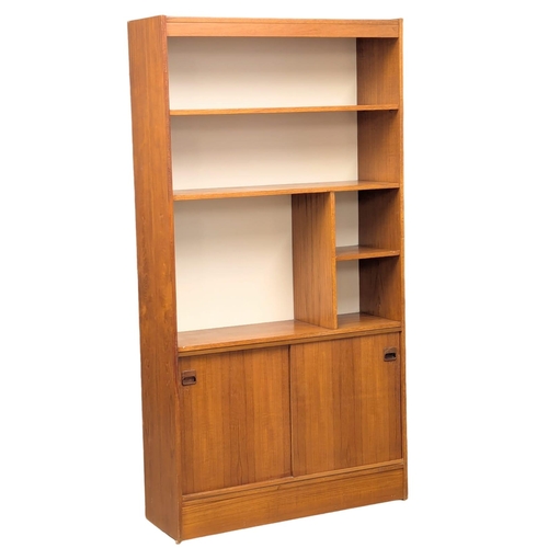 74 - A Danish Mid Century teak shelving unit / open bookcase with sliding door / cupboard. 1960s. 91x29.5... 