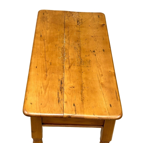 784 - A 19th Century Victorian pine farmhouse side table with drawer and turned legs. 90x43x74cm.