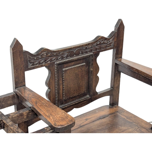 793 - An Early 20th Century oak combination bench / stick stand. 93x90cm