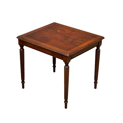 805 - A pair of Regency style inlaid mahogany lamp tables/side tables, on reeded legs. 47x40x41cm.