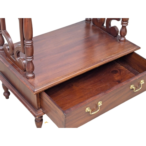 821 - A large Victorian style mahogany whatnot. 66x40x146cm