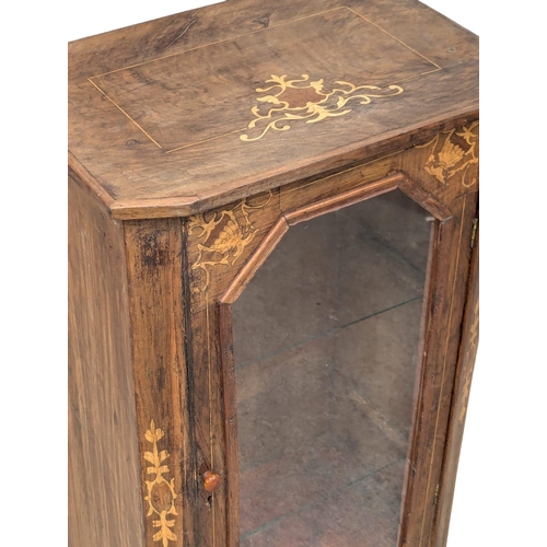 830 - A Victorian inlaid walnut pier cabinet. 51x35x81cm