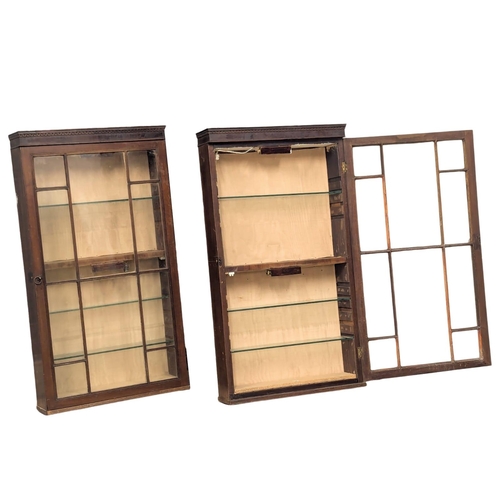 85 - A pair of George III, Early 19th Century mahogany wall hanging shop display cabinets with astragal g... 