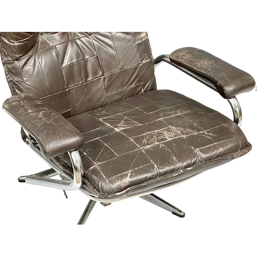 863 - A Danish Mid Century leather and chrome framed armchair.