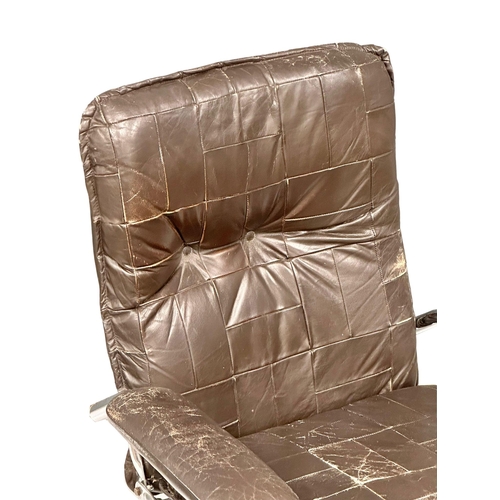 863 - A Danish Mid Century leather and chrome framed armchair.