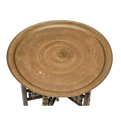 870 - An Early 20th Century Burmese folding table with engraved brass top. Circa 1900-1920. 58x59cm