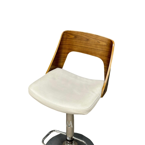 886 - A set of 4 Eames style swivel bar stools. (6)