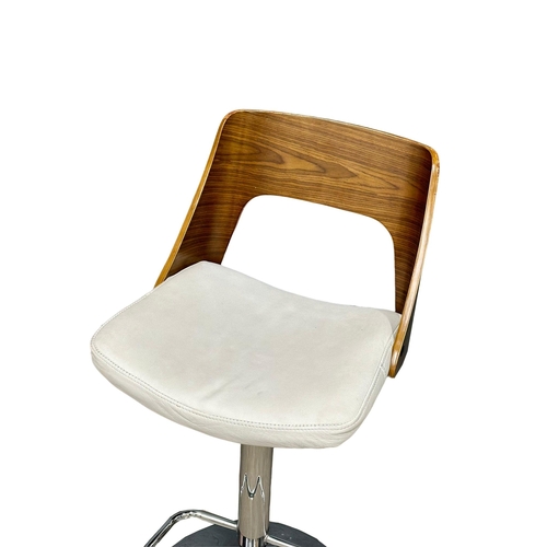 886 - A set of 4 Eames style swivel bar stools. (6)