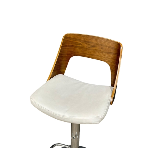 886 - A set of 4 Eames style swivel bar stools. (6)