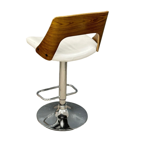 886 - A set of 4 Eames style swivel bar stools. (6)