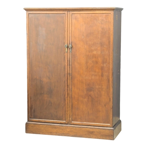 906 - A 1920s / 1930s gentleman's fitted Compactom wardrobe. 128x55x175cm