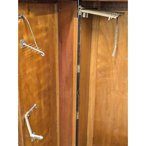 906 - A 1920s / 1930s gentleman's fitted Compactom wardrobe. 128x55x175cm