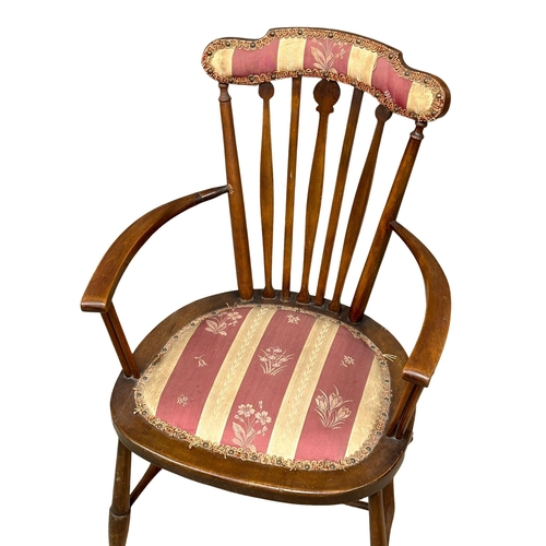 916 - An Edwardian mahogany parlour armchair.