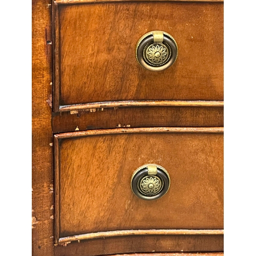 919 - A Georgian style mahogany serpentine front chest of drawers. 54x42x93cm