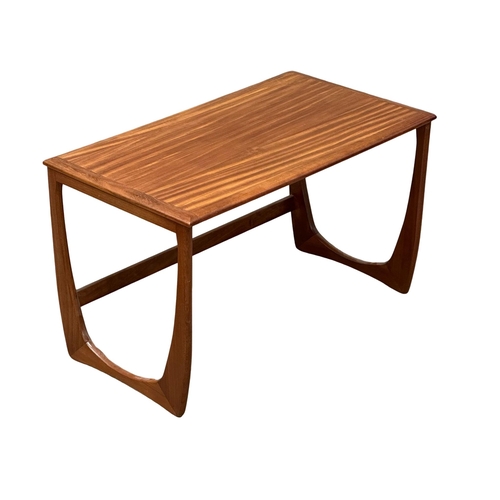 93 - A GPlan style Mid Century teak coffee table, with 2 nesting tables. In the manner of Victor Wilkins.