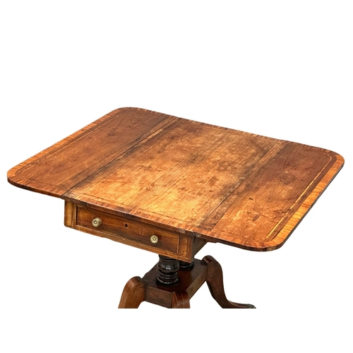 947 - A Regency, Early 19th Century inlaid rosewood pedestal Pembroke table with drawer and brass lion paw... 