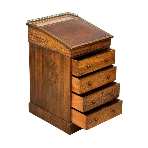 95 - A George IV rosewood davenport desk with leather top. Circa 1820.