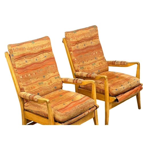 955C - A pair of vintage Cintique armchairs.