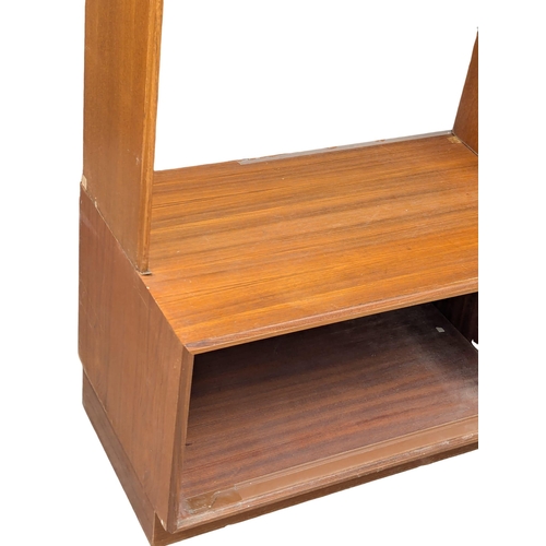 985 - A G-Plan Mid Century teak shelving unit with sliding doors. 152.5x46x199cm