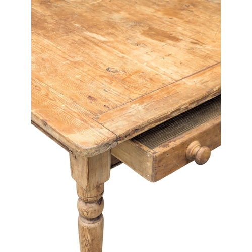 99 - A 19th Century Victorian pine farmhouse kitchen table with drawer. 130x95.5x73cm