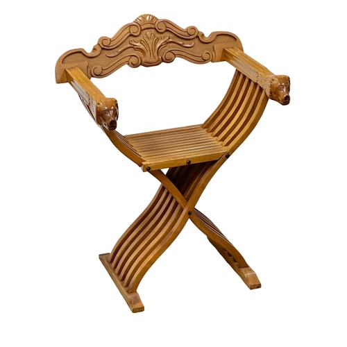 999 - A folding Savonarola chair.