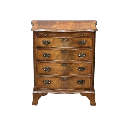 114 - An Early 20th Century Chippendale Revival mahogany serpentine front chest of drawers, with brushing ... 