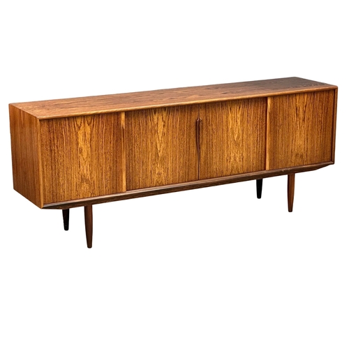 151 - Gunni Omman for Axel Christensen Odder.  A Danish Mid Century rosewood sideboard. Designed by Gunni ... 