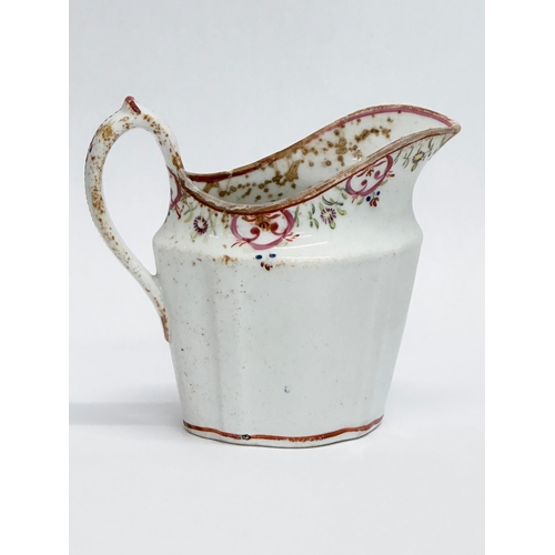 179 - A Late 18th Century English soft paste cream jug by New Hall. Circa 1780.