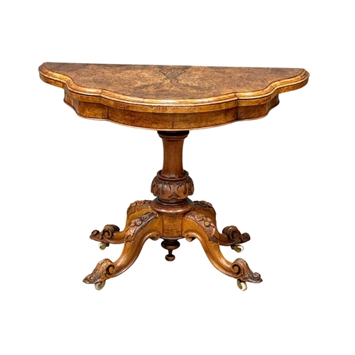 200 - A 19th Century Victorian burr walnut turnover games table with pedestal base. 98x102x72cm. (10)