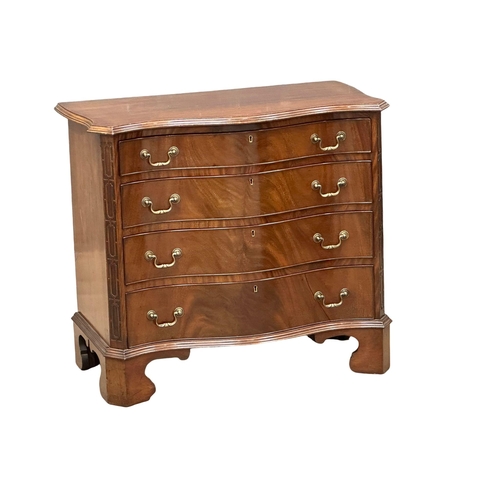 230 - An Early 20th Century Chippendale Revival mahogany serpentine front chest of drawers on bracket feet... 