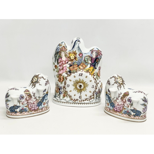 286 - Hutschenreuther. A Late 20th Century German 3 piece porcelain clock set. By Hutschenreuther. Clock 2... 