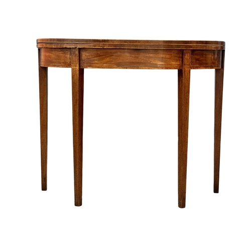 366 - A George III, Early 19th Century inlaid mahogany turnover tea table. In the Sheraton style. Circa 18... 