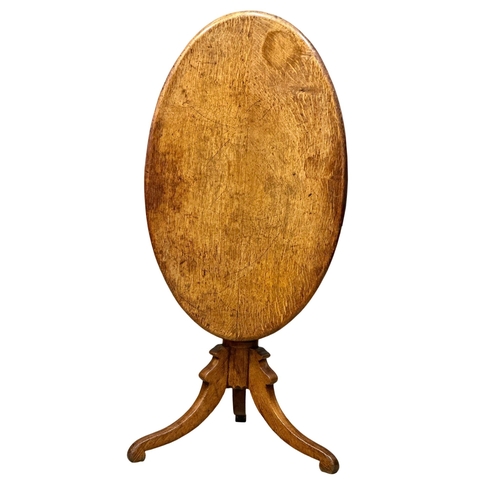 383 - A 19th Century Victorian oak tilt top table. 88x54x72.5cm. (9)