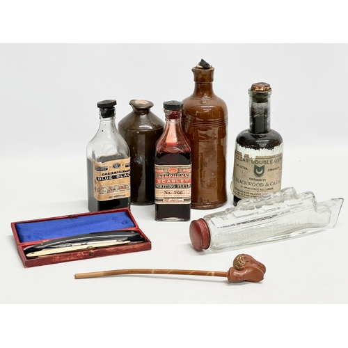 1000 - A job lot of collectables. A Queen Mary glass bottle. A clay pipe with makers mark, cut throat razor... 