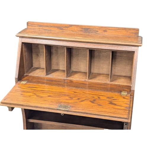 1004 - An Early 20th Century oak Larkin fall front desk. Circa 1920-1930. 76x27x105.5cm. (6)