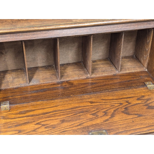 1004 - An Early 20th Century oak Larkin fall front desk. Circa 1920-1930. 76x27x105.5cm. (6)