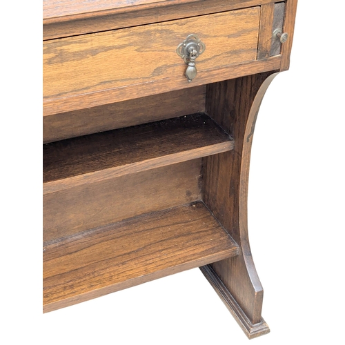 1004 - An Early 20th Century oak Larkin fall front desk. Circa 1920-1930. 76x27x105.5cm. (6)