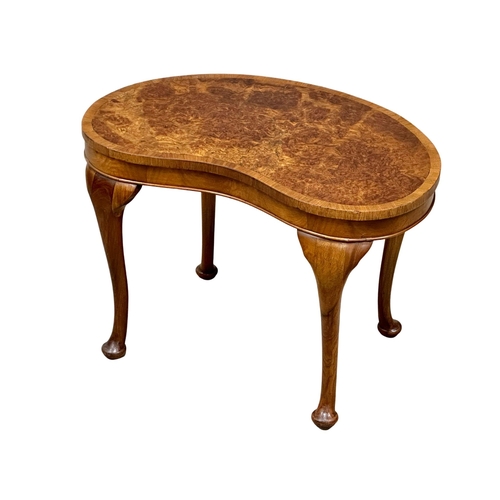 1009 - A Mid 20th Century burr walnut kidney shaped occasional table. 61x39x40cm. (9)