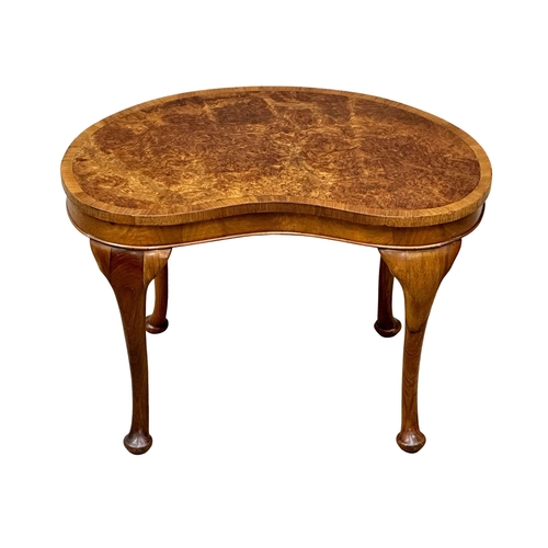 1009 - A Mid 20th Century burr walnut kidney shaped occasional table. 61x39x40cm. (9)