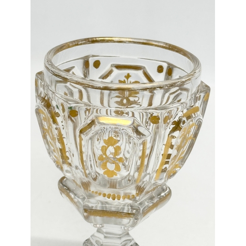 26 - Baccarat. A 19th Century French gilt “Harcourt Empire” glass cup. 10x9.5x16cm.