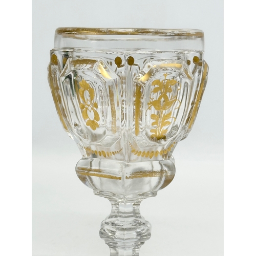 26 - Baccarat. A 19th Century French gilt “Harcourt Empire” glass cup. 10x9.5x16cm.