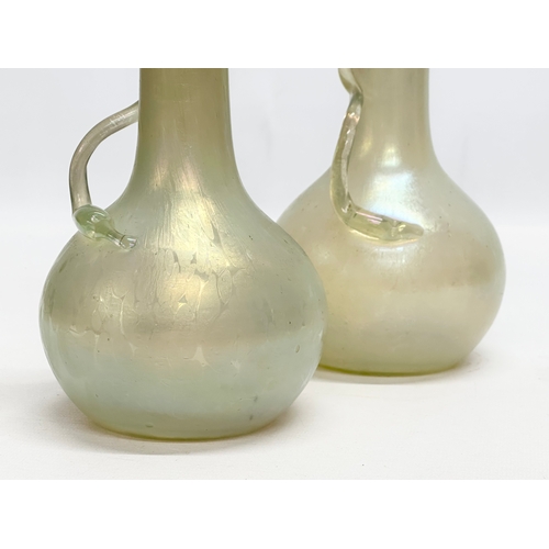 40 - Josef Rindskopf. A pair of Bohemian “Snake Trail” iridescent uranium glass vases. By Rindskopf & Co.... 