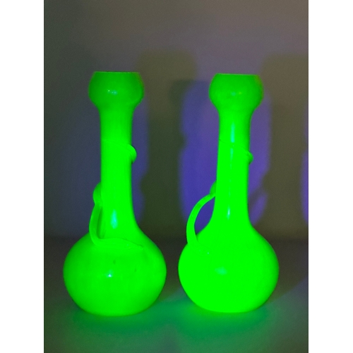 40 - Josef Rindskopf. A pair of Bohemian “Snake Trail” iridescent uranium glass vases. By Rindskopf & Co.... 