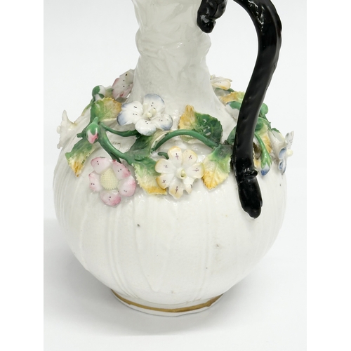 122 - A 19th Century Victorian flower encrusted jug. 9x14cm