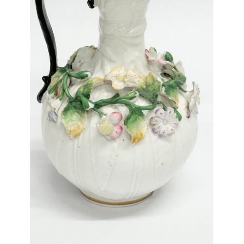 122 - A 19th Century Victorian flower encrusted jug. 9x14cm