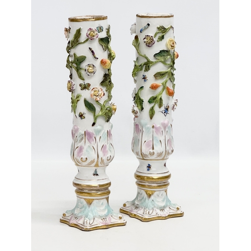 121 - A pair of Early 19th Century flower encrusted spill vases, decorated with insects on Corinthian styl... 