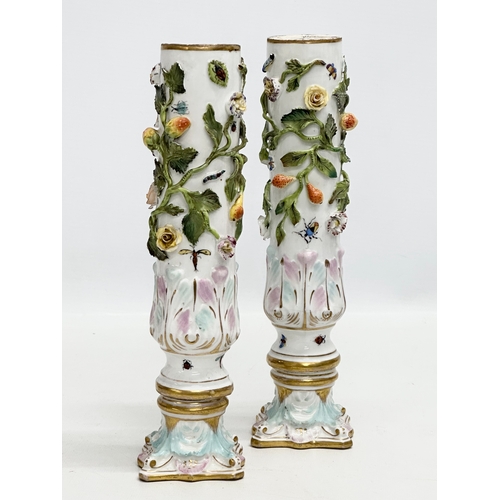 121 - A pair of Early 19th Century flower encrusted spill vases, decorated with insects on Corinthian styl... 