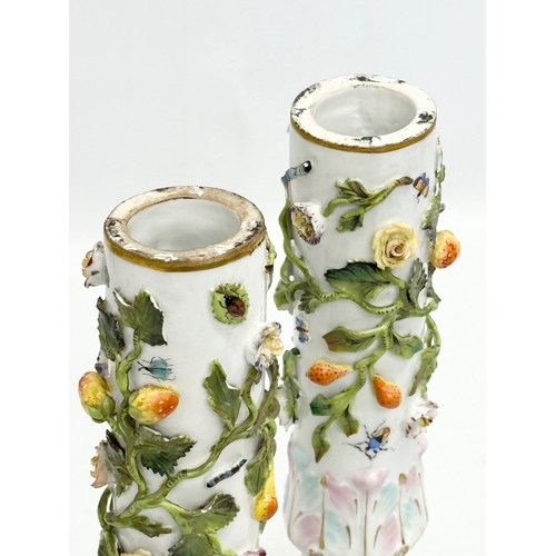 121 - A pair of Early 19th Century flower encrusted spill vases, decorated with insects on Corinthian styl... 