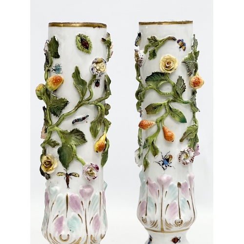 121 - A pair of Early 19th Century flower encrusted spill vases, decorated with insects on Corinthian styl... 