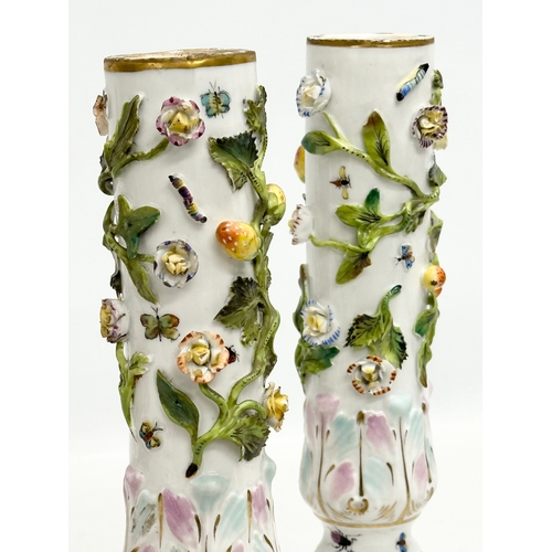 121 - A pair of Early 19th Century flower encrusted spill vases, decorated with insects on Corinthian styl... 